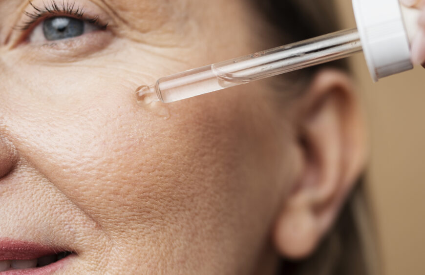 close-up-senior-woman-using-serum